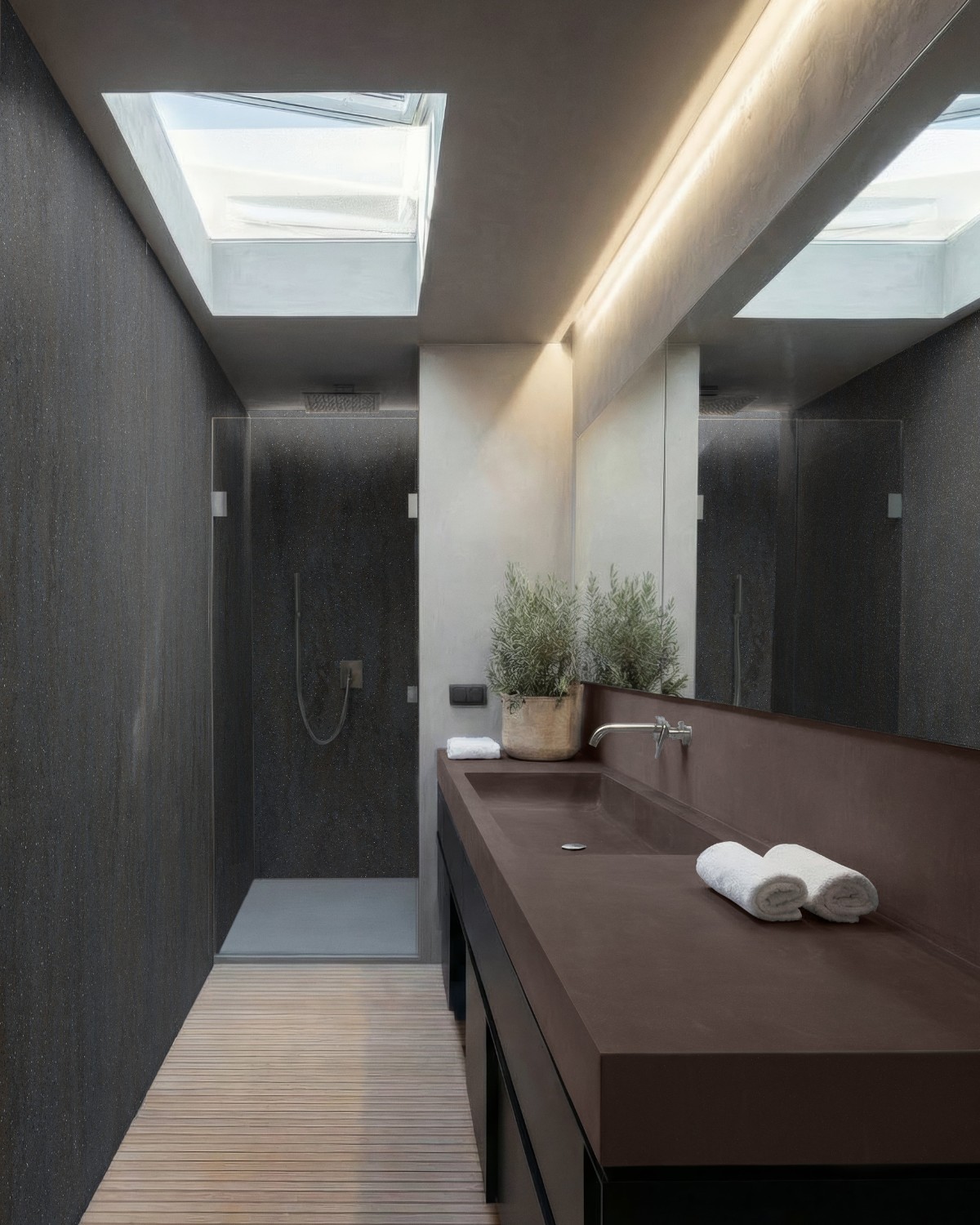 Μοντέρνο μπάνιο με πάγκο Corian® Artista Mocha σε σκούρο καφέ τόνο και ενιαίο νιπτήρα